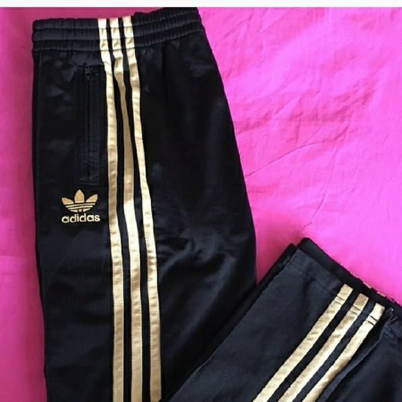 gold and black adidas pants